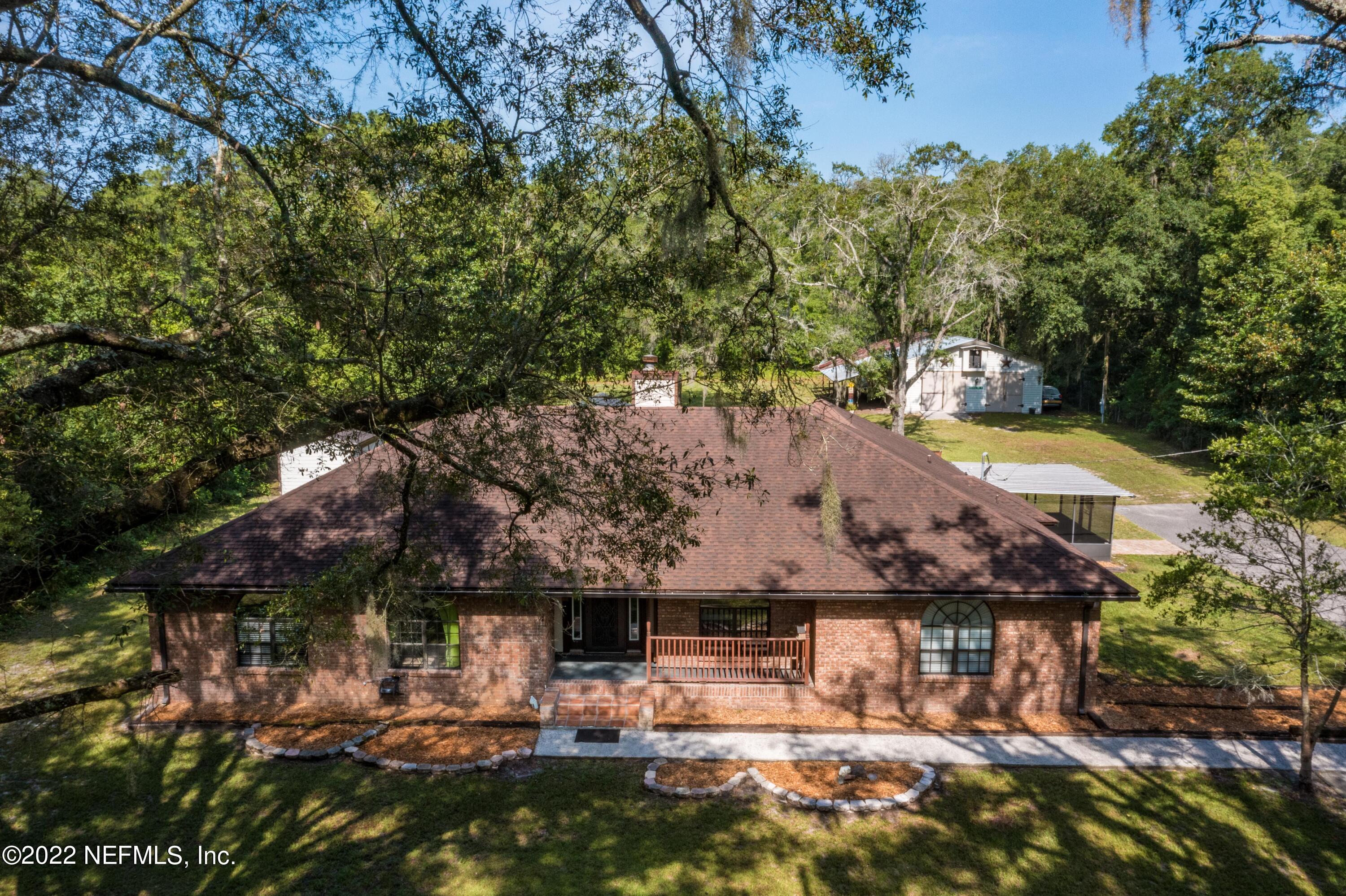 6130 Firestone Road Jacksonville, FL 32244 - Photo 5 of 67 a view of swimming pool with lawn chairs and plants