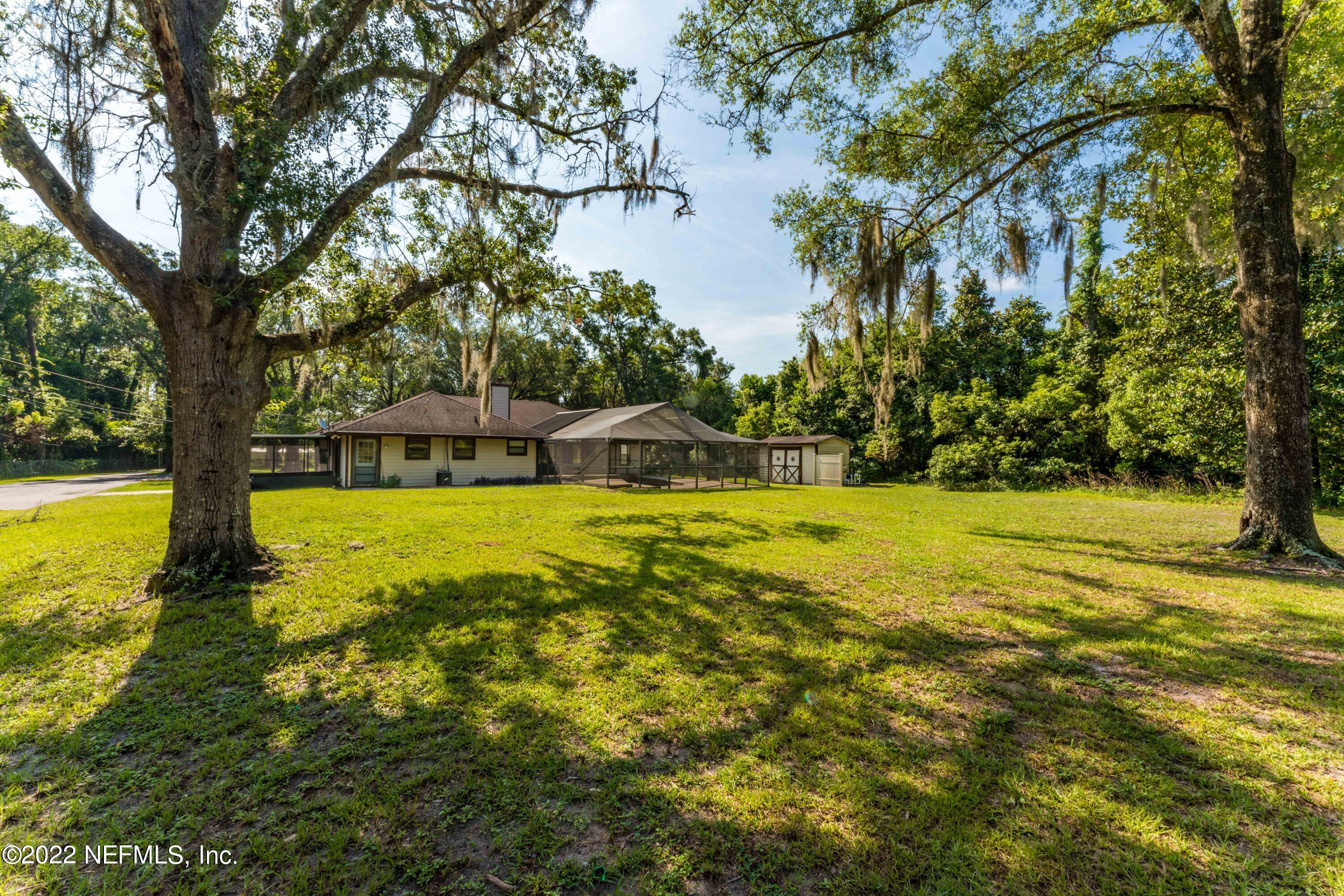 6130 Firestone Road Jacksonville, FL 32244 - Photo 55 of 67 a view of swimming pool with an outdoor space and seating area