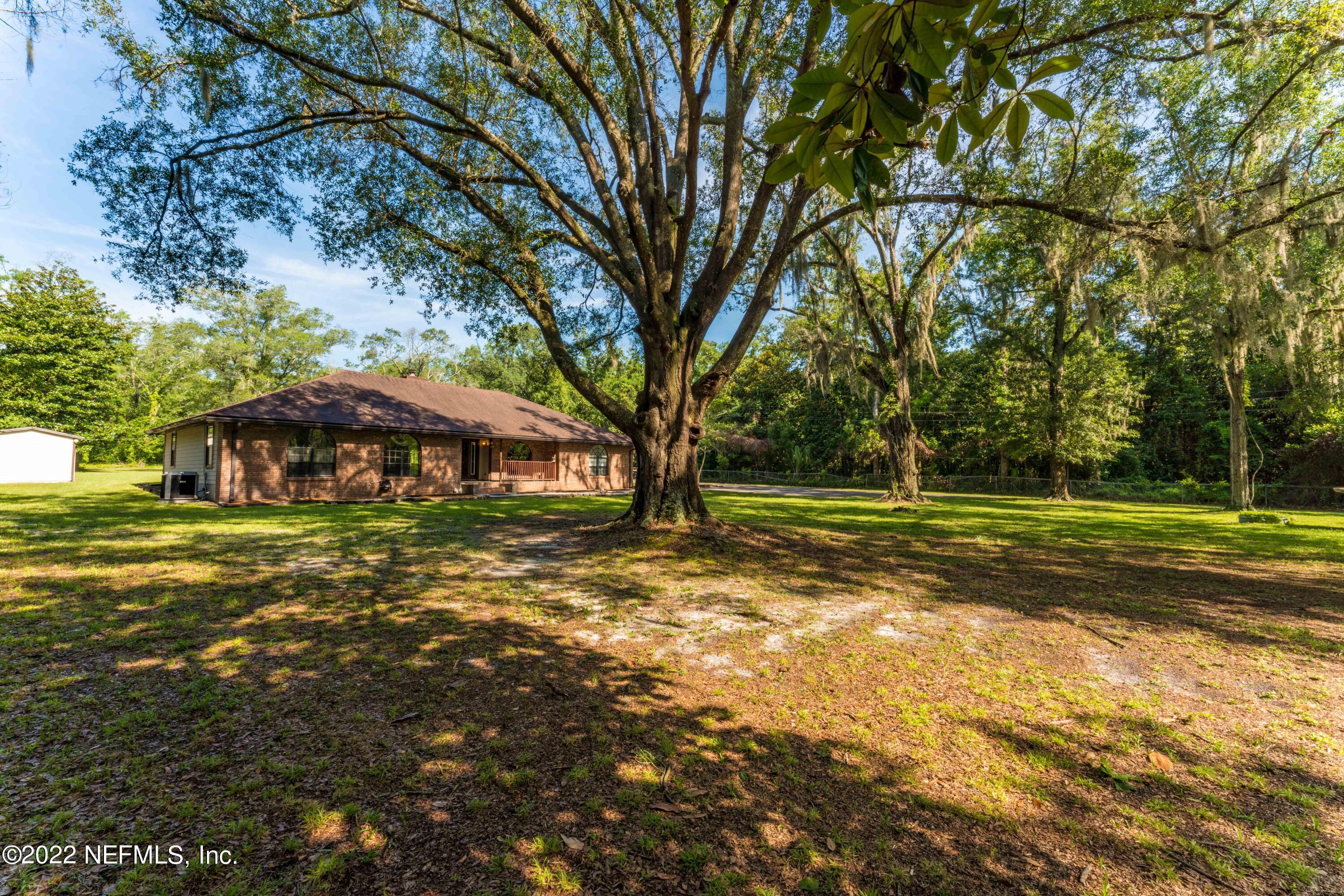 6130 Firestone Road Jacksonville, FL 32244 - Photo 61 of 67 a view of a house with a yard