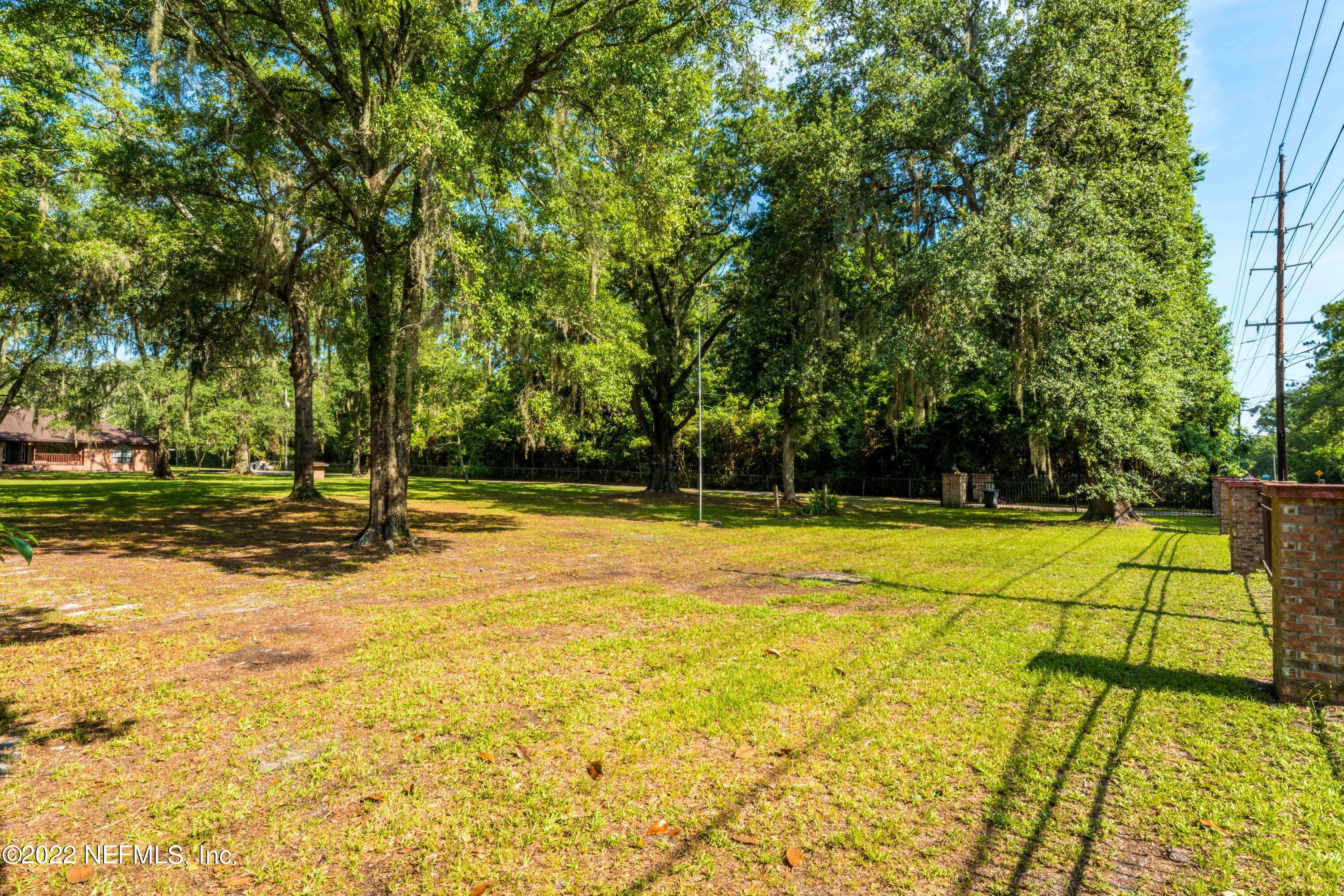 6130 Firestone Road Jacksonville, FL 32244 - Photo 63 of 67 a view of a swimming pool with an outdoor space