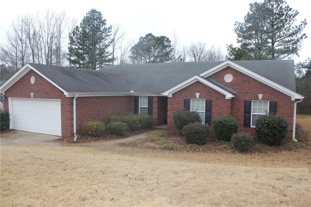 101 Red Bud Road Jefferson, GA 30549 - Photo 1 of 1 a front view of a house with garden