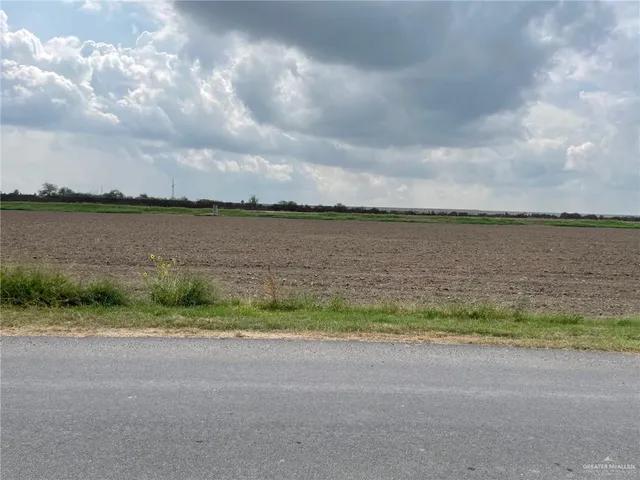 a view of a lake with houses in the back