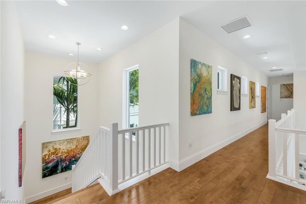 9161 Mercato Way Naples, FL 34108 - Photo 21 of 50 a view of entryway and hall with wooden floor