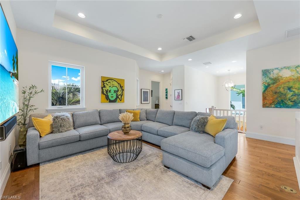 9161 Mercato Way Naples, FL 34108 - Photo 23 of 50 a living room with furniture and a couch