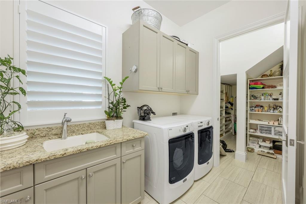9161 Mercato Way Naples, FL 34108 - Photo 25 of 50 a kitchen with granite countertop a sink and a stove