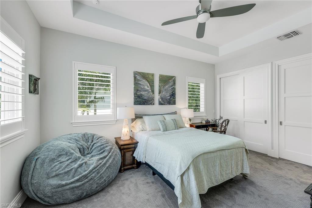 9161 Mercato Way Naples, FL 34108 - Photo 26 of 50 a bedroom with a bed and a couch