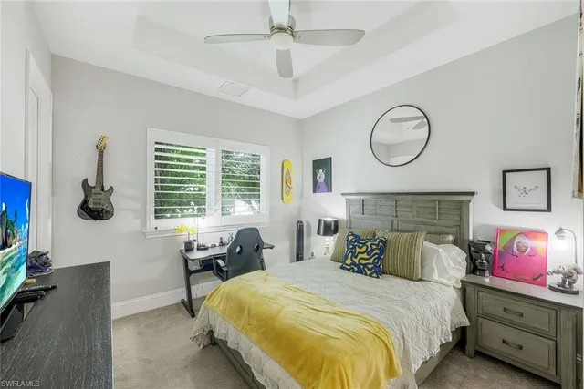 a bedroom with bed and window