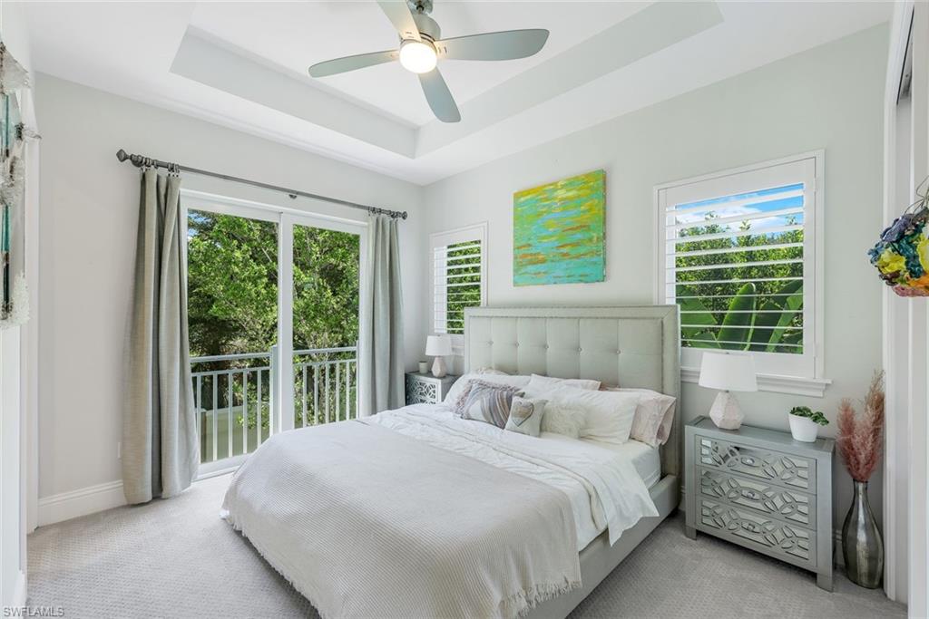 9161 Mercato Way Naples, FL 34108 - Photo 28 of 50 a bedroom with a large bed and a large window