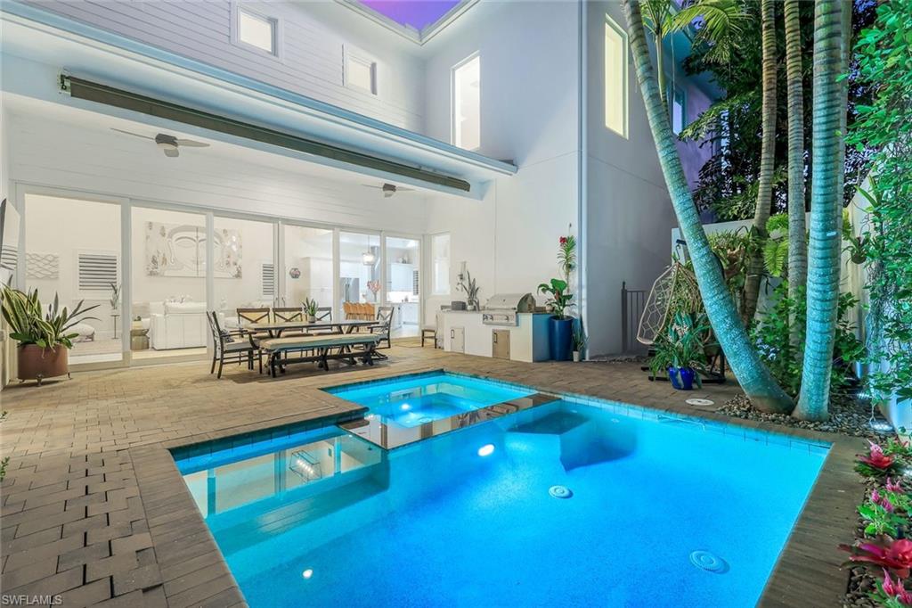 9161 Mercato Way Naples, FL 34108 - Photo 38 of 50 a living room with furniture pool table and chairs
