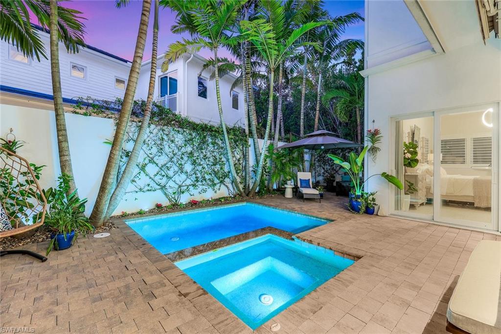 9161 Mercato Way Naples, FL 34108 - Photo 39 of 50 a view of a backyard with plants and a patio