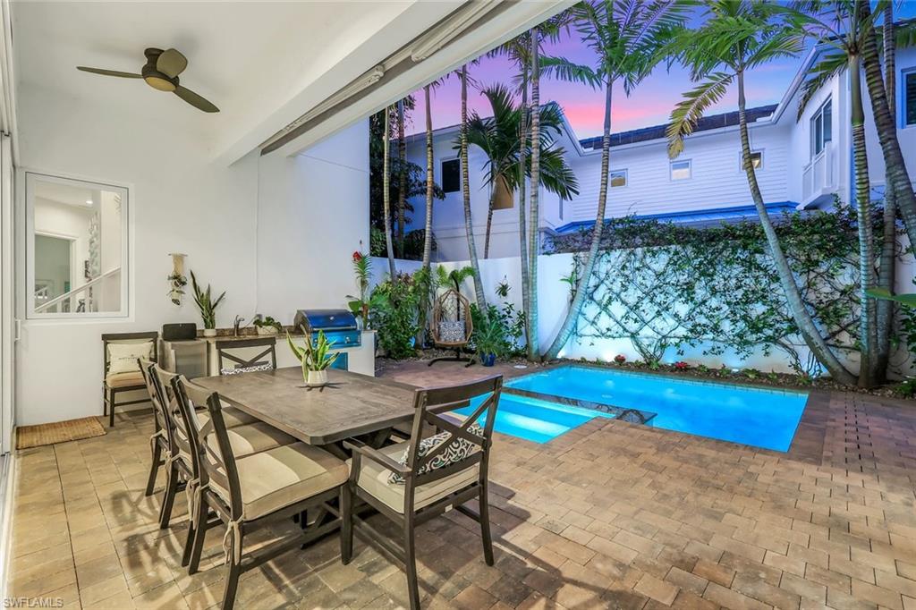 9161 Mercato Way Naples, FL 34108 - Photo 40 of 50 a view of a backyard with a patio