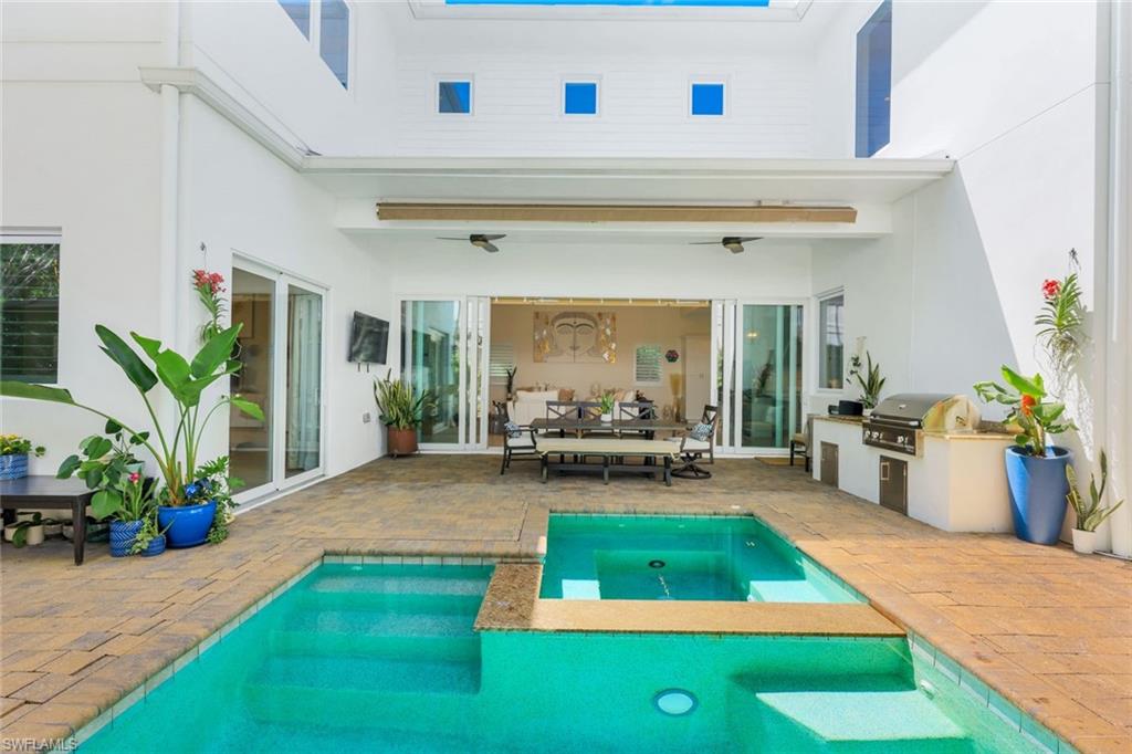 9161 Mercato Way Naples, FL 34108 - Photo 42 of 50 a view of outdoor space yard deck patio and dining table