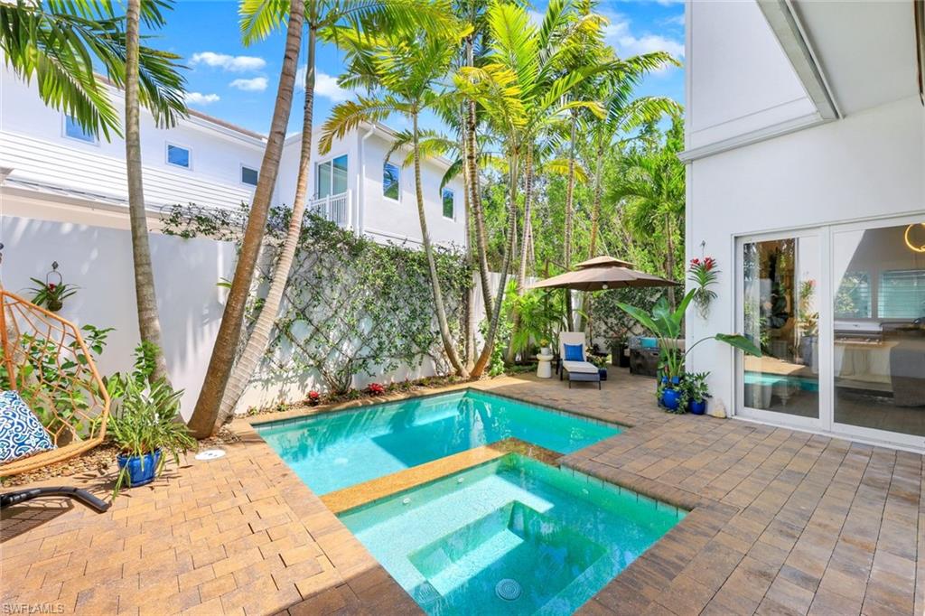 9161 Mercato Way Naples, FL 34108 - Photo 49 of 50 a view of a backyard with a patio