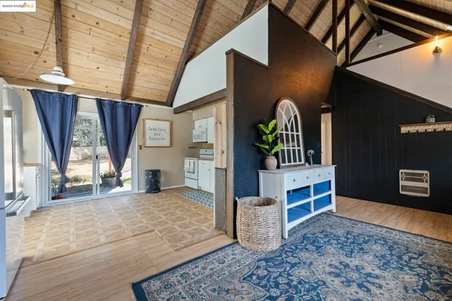 a view of livingroom with furniture and window