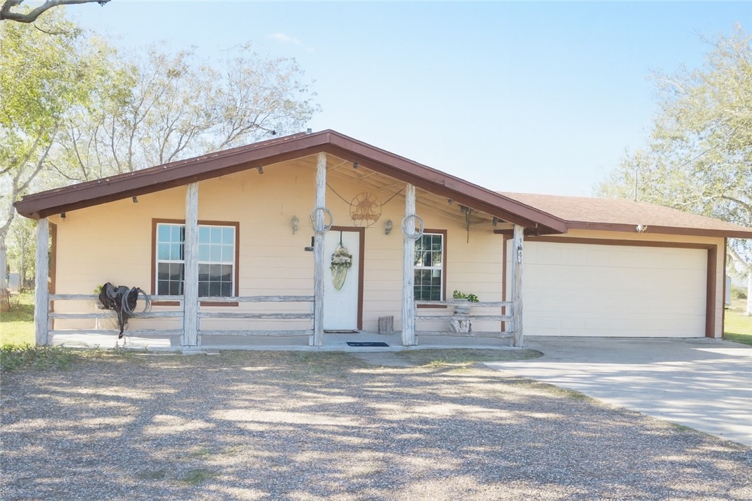 7643 County Road 2415 Sinton, TX 78387 - Photo 1 of 25 a front view of a house with a yard