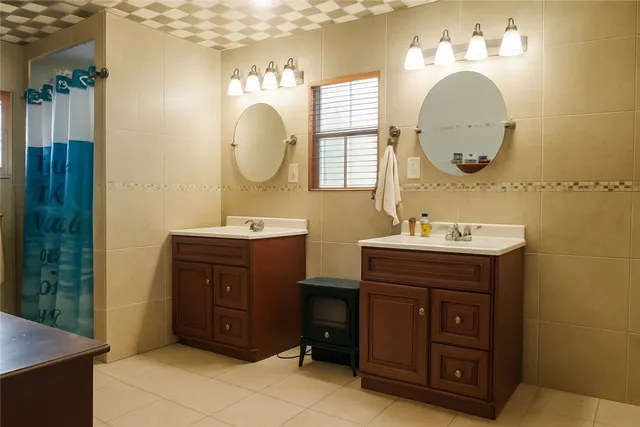 a bathroom with a sink a mirror and a shower