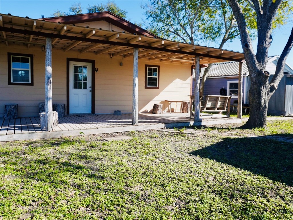 7643 County Road 2415 Sinton, TX 78387 - Photo 22 of 25 a front view of a house with garden