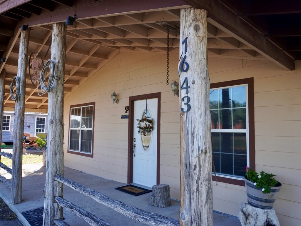 7643 County Road 2415 Sinton, TX 78387 - Photo 5 of 25 a front view of a house with garden