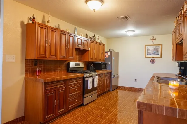 a bathroom with a sink a mirror and shower