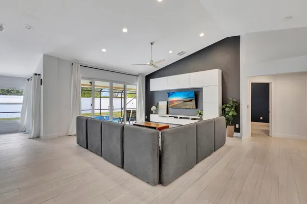 a kitchen with sink cabinets and wooden floor