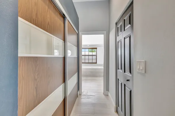 a spacious bathroom with a tub sink and mirror
