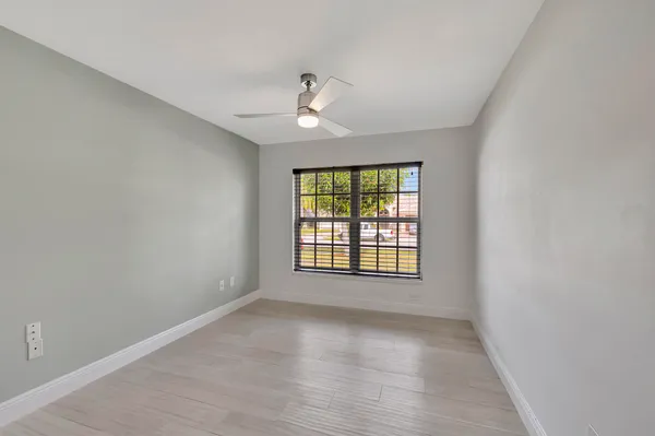 a view of a house with swimming pool in front of it