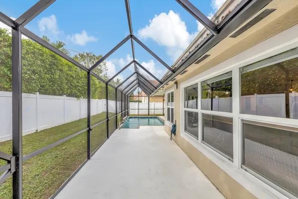 a front view of a house with a garden and yard
