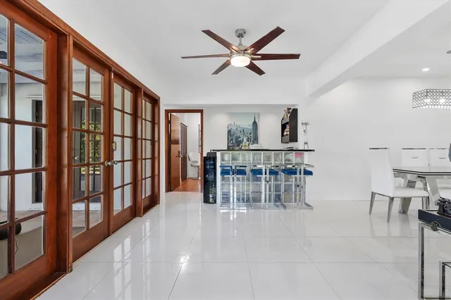 a view of a livingroom with furniture and staircase