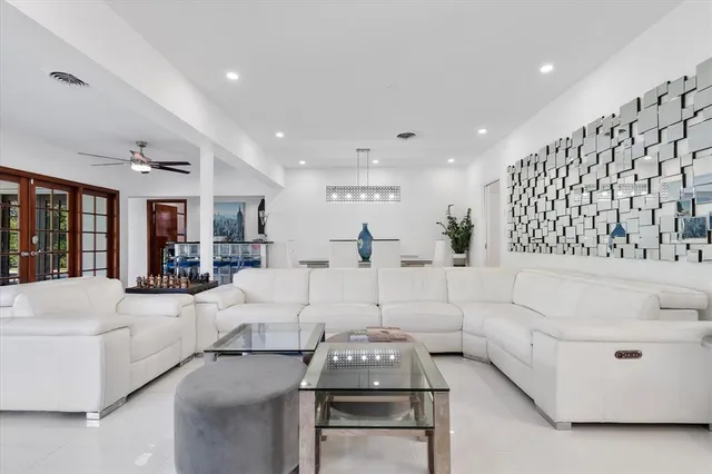 a living room with furniture and white walls