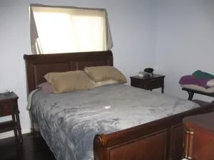 a bedroom with bed and window