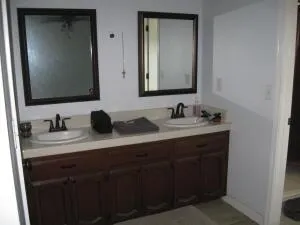 a bathroom with mirror sink and vanity