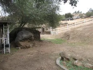 a view of a patio with table and chairs with wooden floor and fence