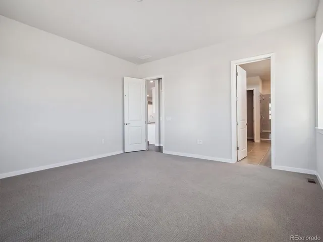an empty room with closet area