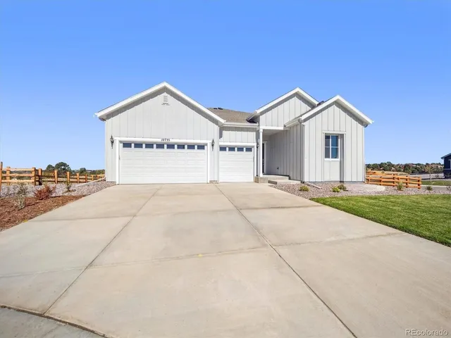 a view of garage and yard
