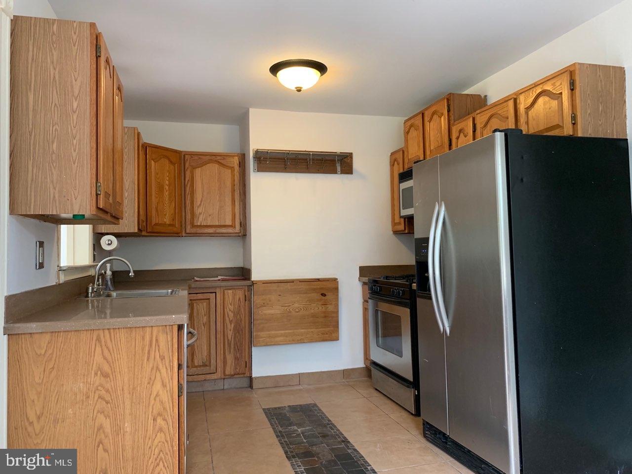 6 Miry Brook Road Hamilton, NJ 08690 - Photo 7 of 32 Kitchen with CT floor & stainless steel appliances
