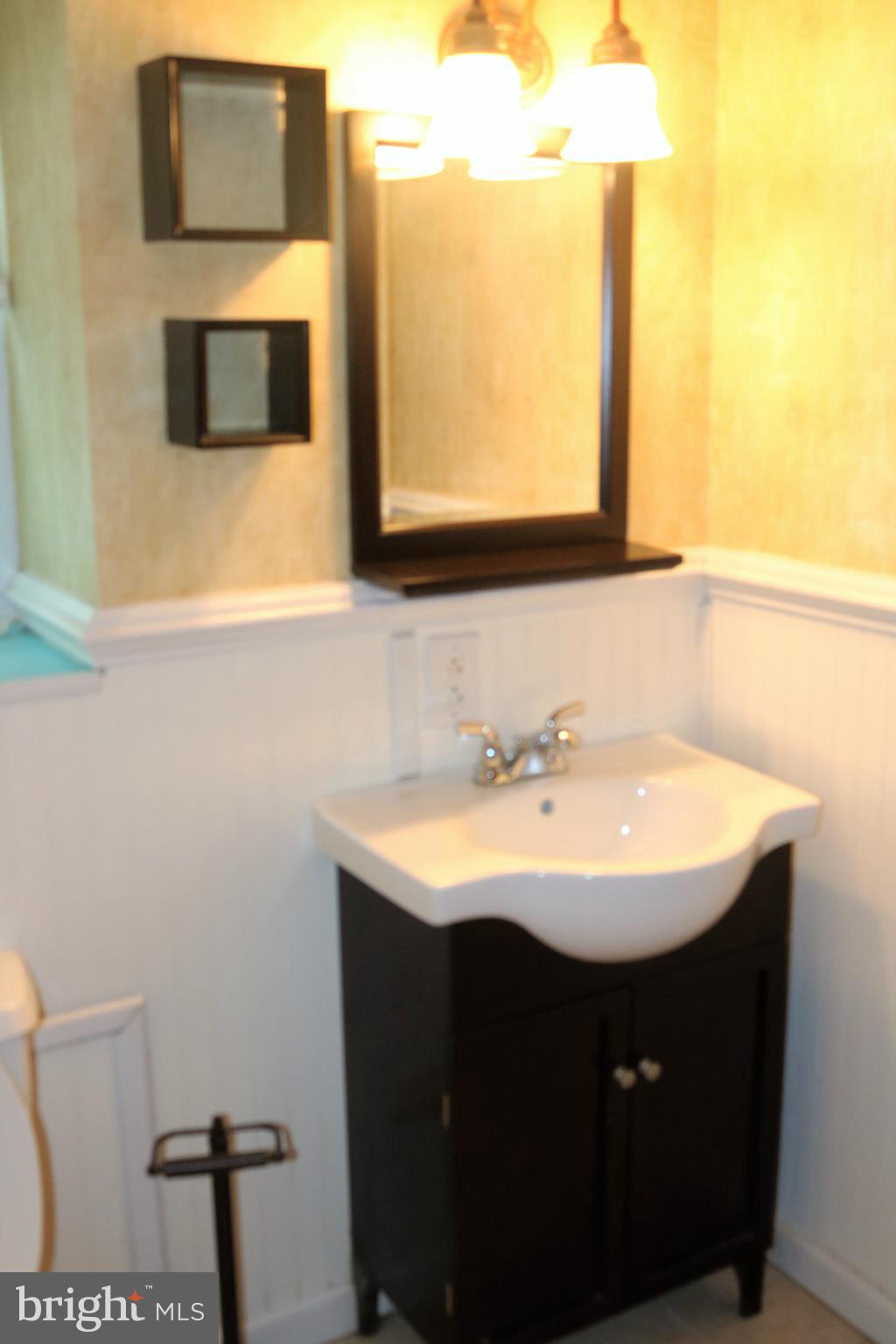 6 Miry Brook Road Hamilton, NJ 08690 - Photo 10 of 32 Powder Room with vanity, sink, toilet and lighting