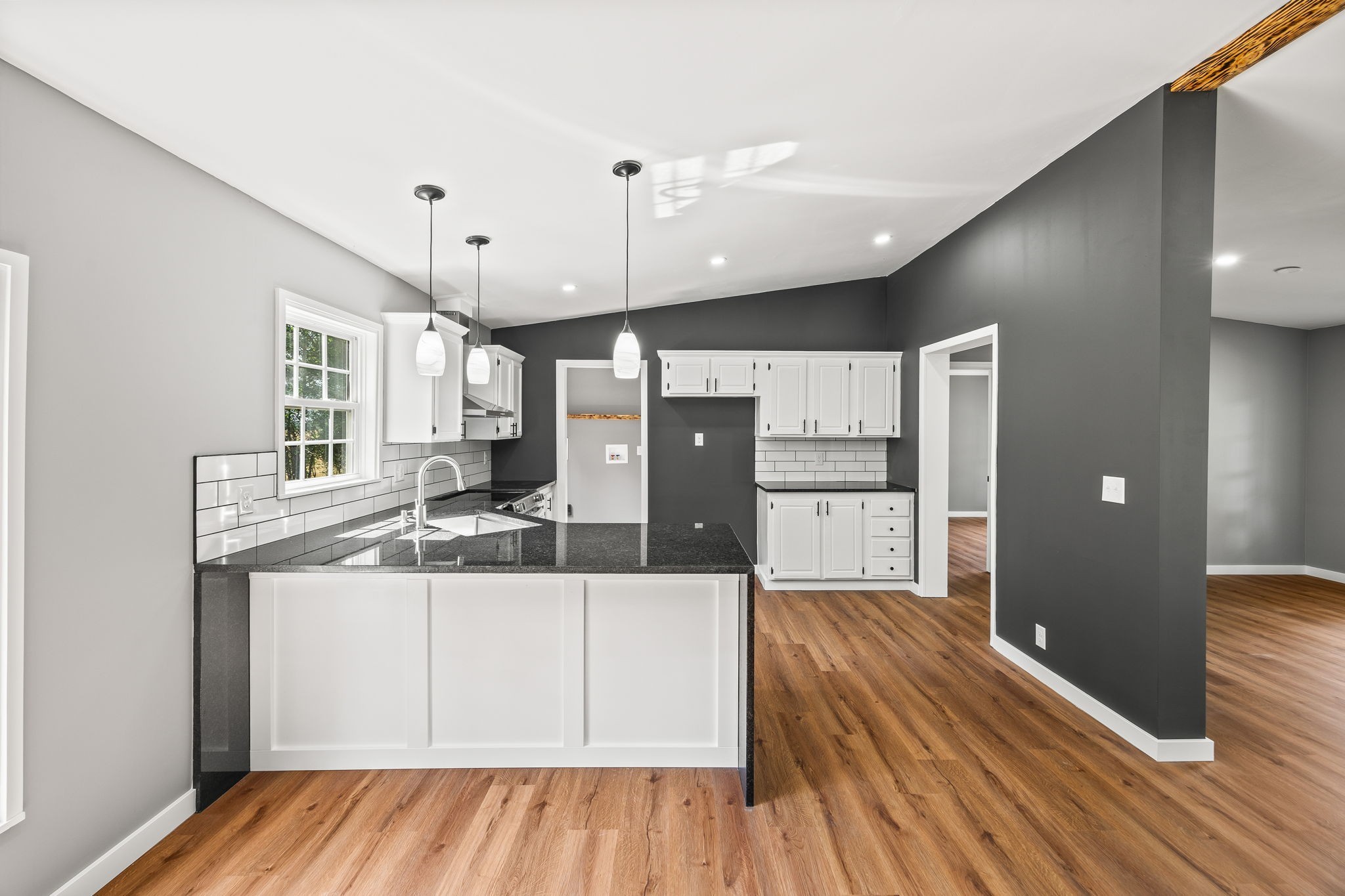 83 Summer Circle Morrison, TN 37357 - Photo 11 of 29 a kitchen with stainless steel appliances kitchen island granite countertop a refrigerator a sink and wooden floors