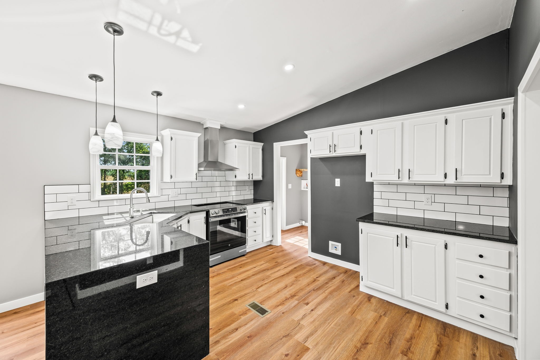 83 Summer Circle Morrison, TN 37357 - Photo 12 of 29 a kitchen with stainless steel appliances granite countertop a refrigerator a stove and a wooden floors
