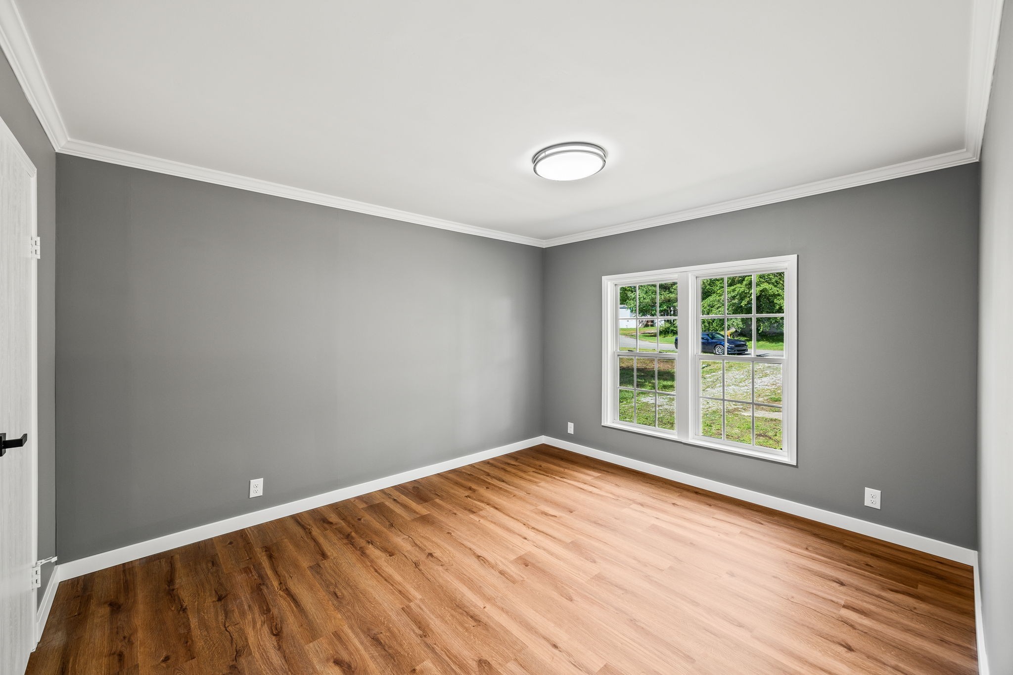 83 Summer Circle Morrison, TN 37357 - Photo 14 of 29 an empty room with wooden floor and windows