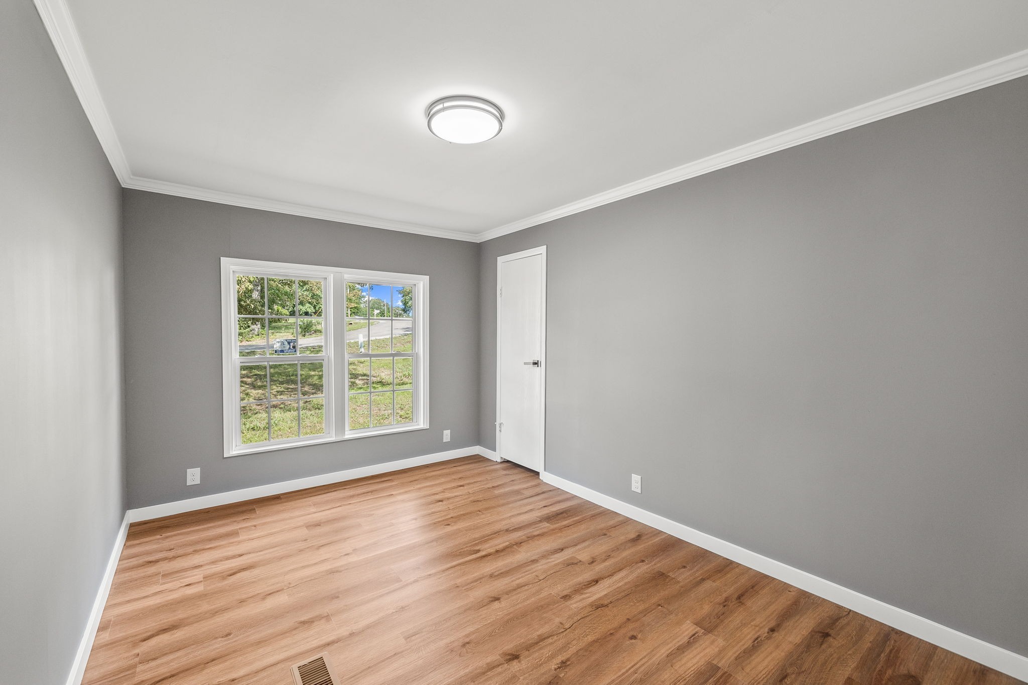 83 Summer Circle Morrison, TN 37357 - Photo 18 of 29 a view of an empty room with wooden floor and a window