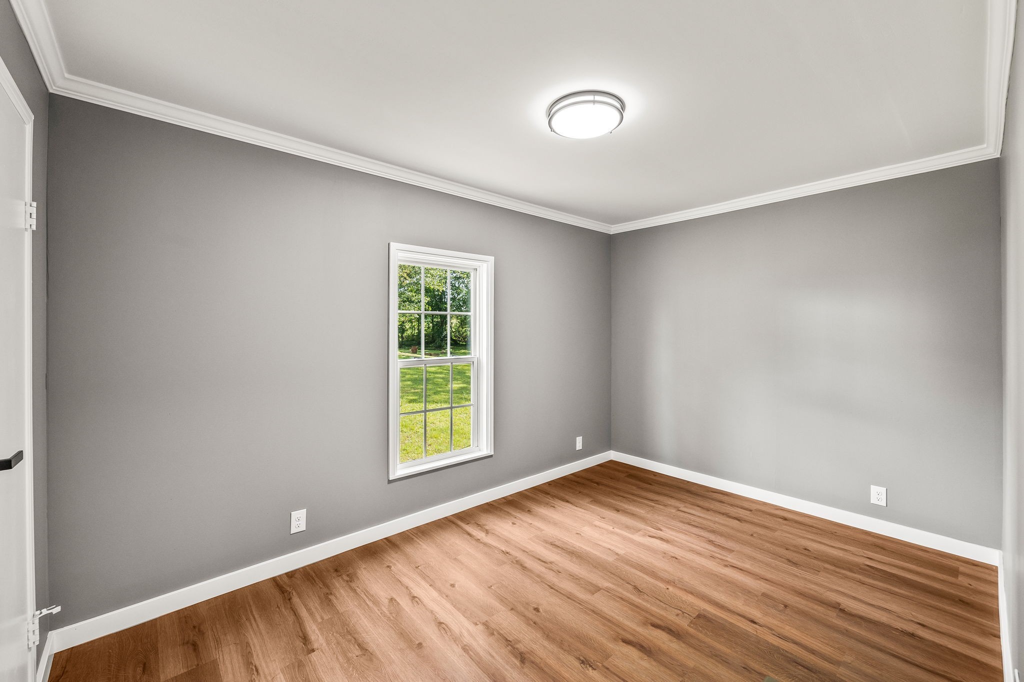 83 Summer Circle Morrison, TN 37357 - Photo 20 of 29 an empty room with wooden floor and windows