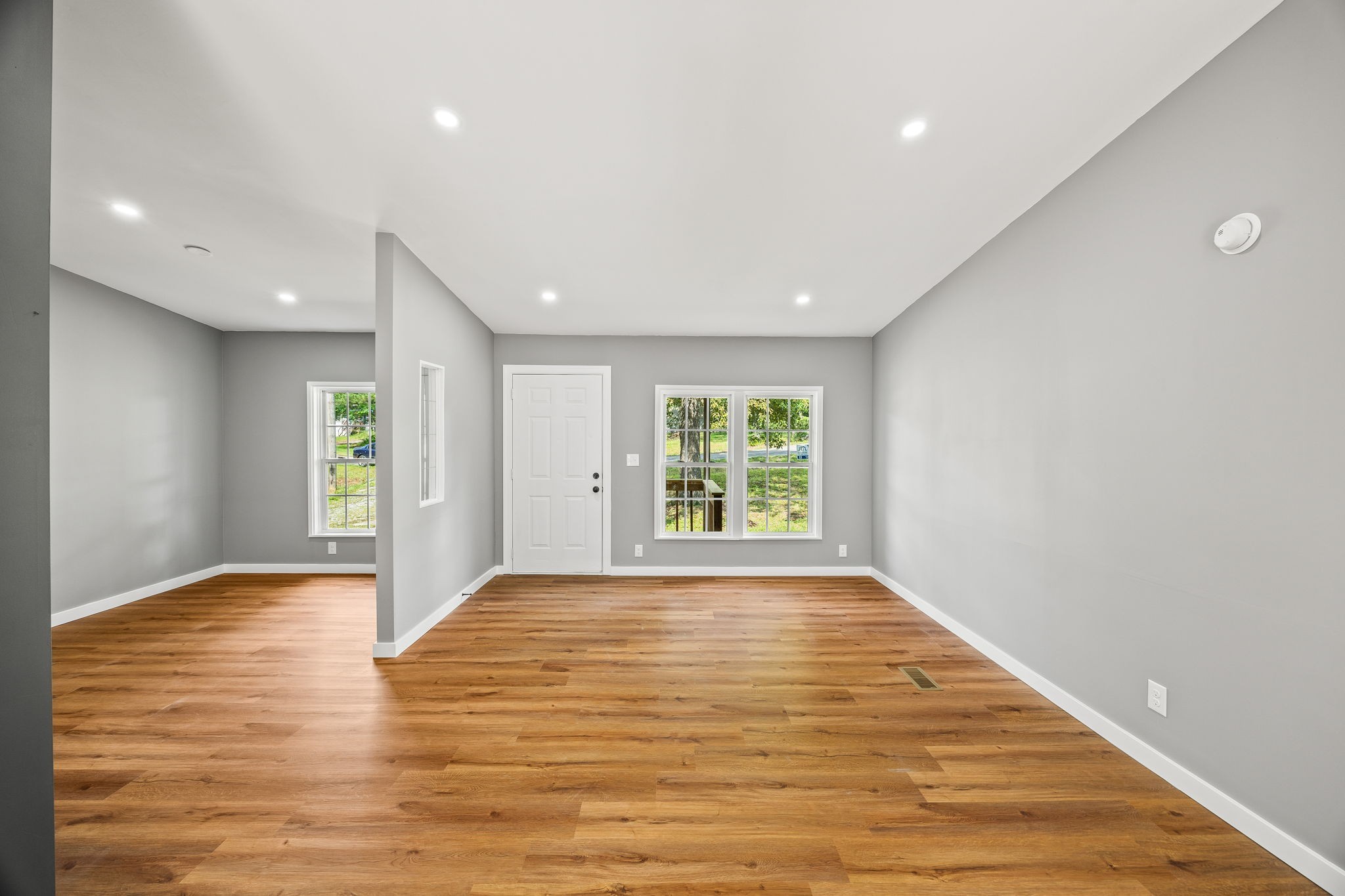 83 Summer Circle Morrison, TN 37357 - Photo 4 of 29 a view of an empty room with wooden floor and a window
