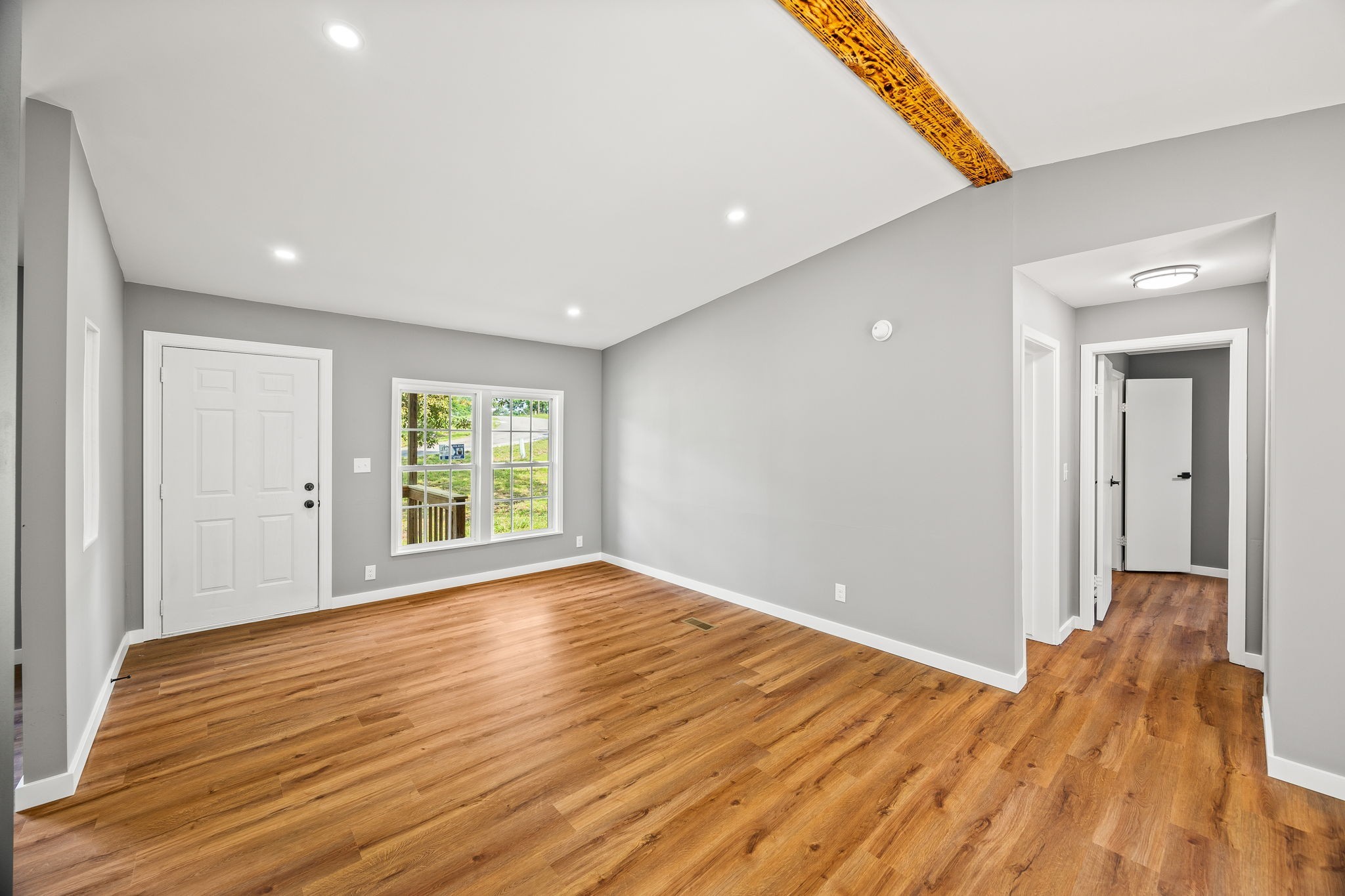 83 Summer Circle Morrison, TN 37357 - Photo 6 of 29 a view of an empty room with wooden floor and a window