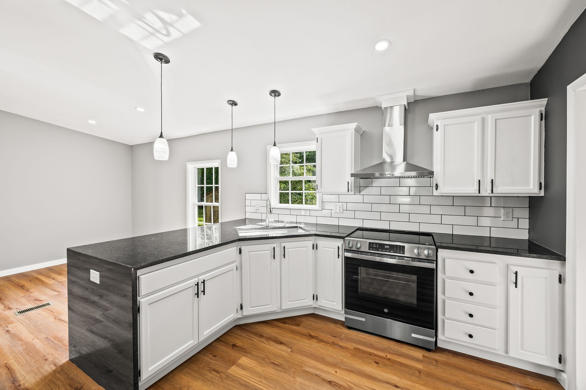 83 Summer Circle Morrison, TN 37357 - Photo 10 of 29 a kitchen with granite countertop a sink stove and cabinets