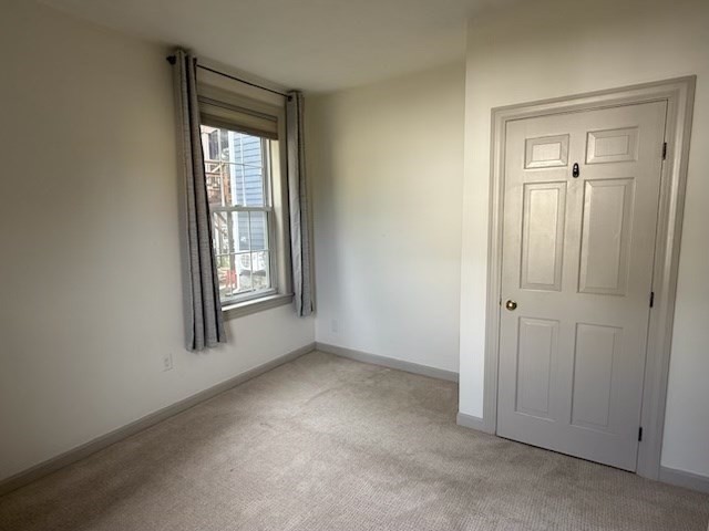 10 River Street, Unit 1 Danvers, MA 01923 - Photo 13 of 17 a view of an empty room with a window