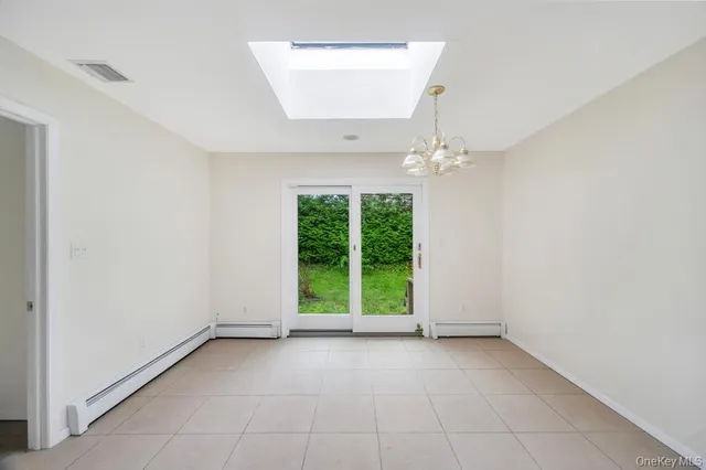 a view of a room with a large window