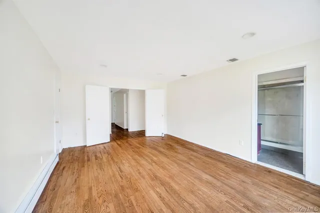 a large white bed in a room