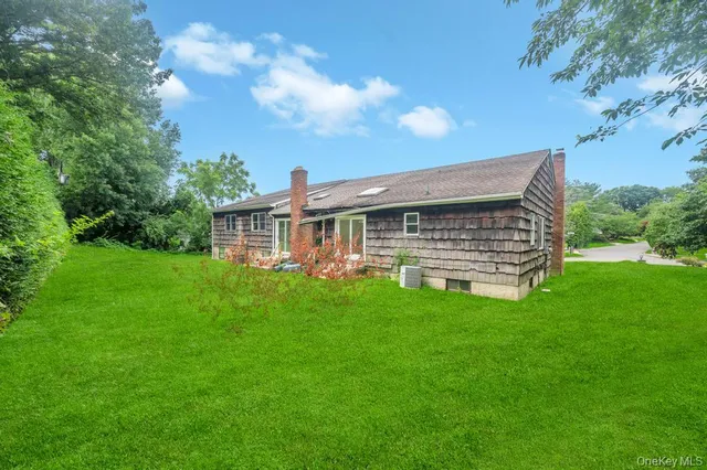 a view of a house with a backyard