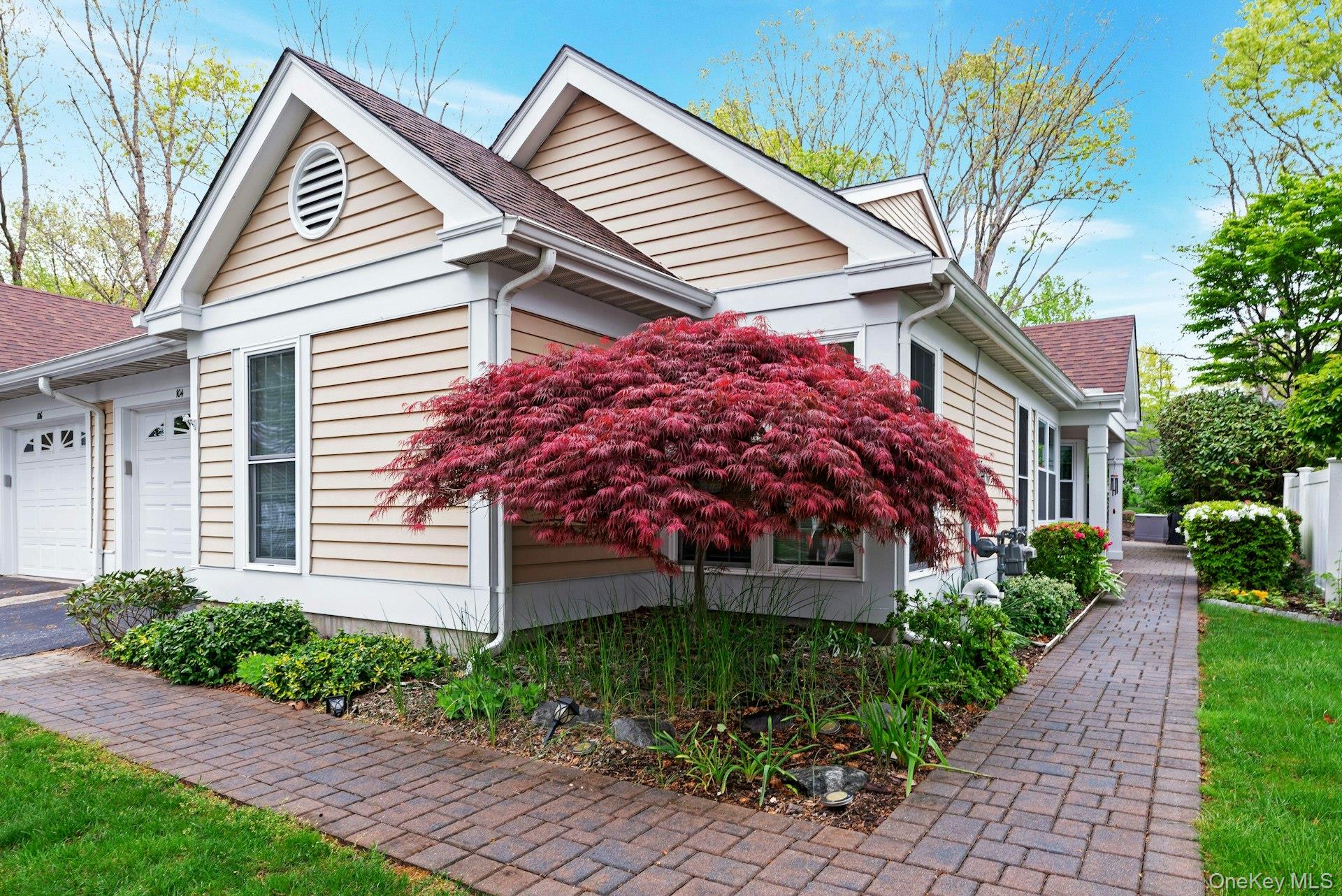 104 Glen Drive Ridge, NY 11961 - Photo 2 of 25 a front view of a house with garden