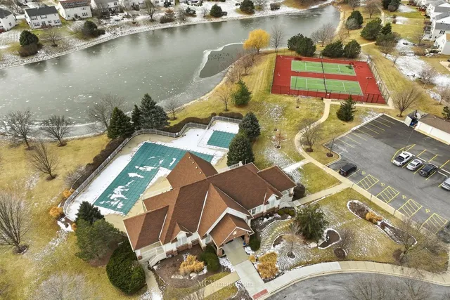 an aerial view of a house with a lake view